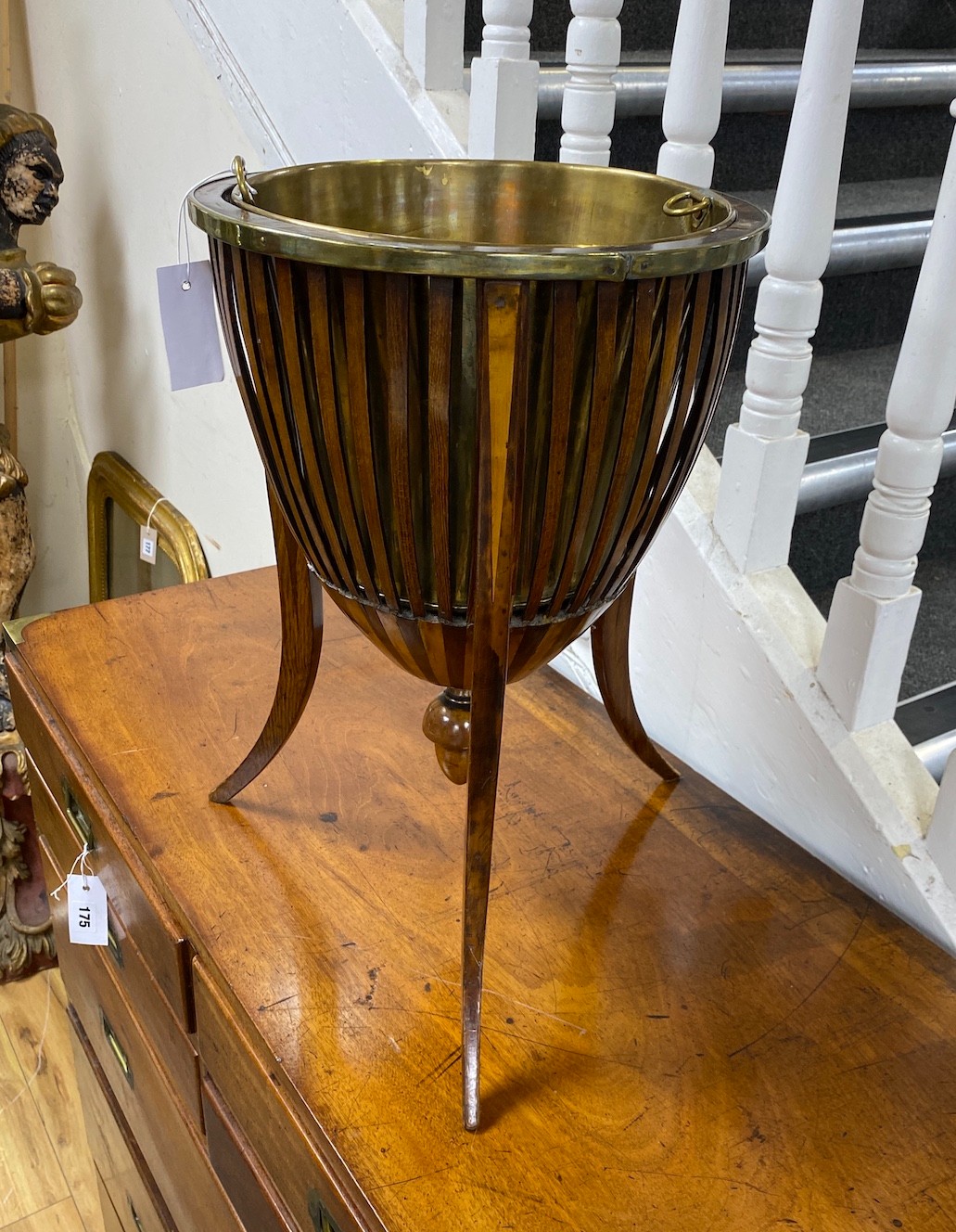 A late 19th / early 20th century Dutch inlaid mahogany jardiniere with brass liner diameter 33cm, height 50cm.